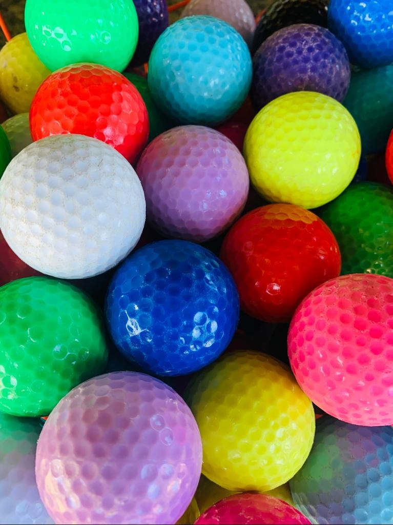 Bright colorful golf balls ready to play at Golf Mountain Mini Golf