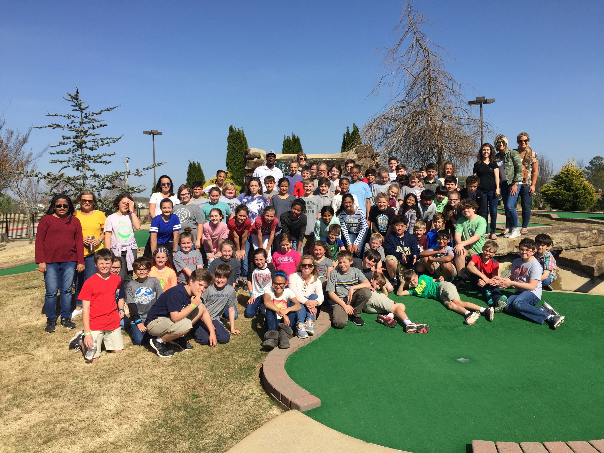 Youth group enjoying an outdoor field trip activity